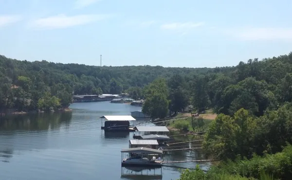 Private docks along a wooded Grand Lake cove.